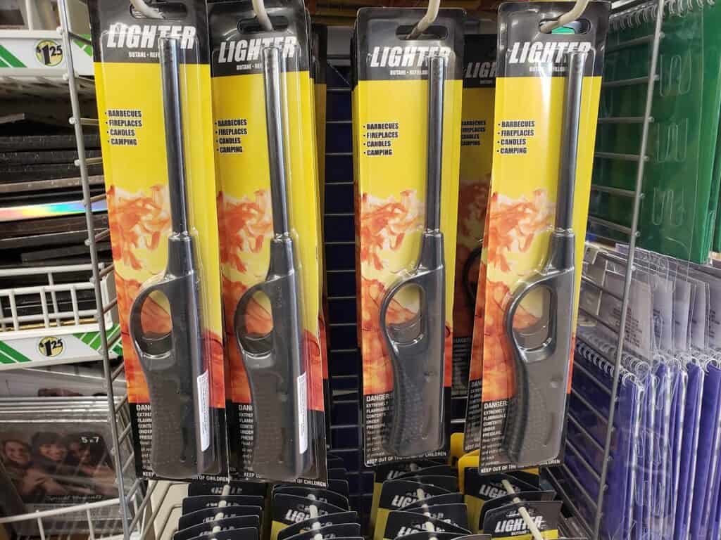 Several lighters on an end cap.