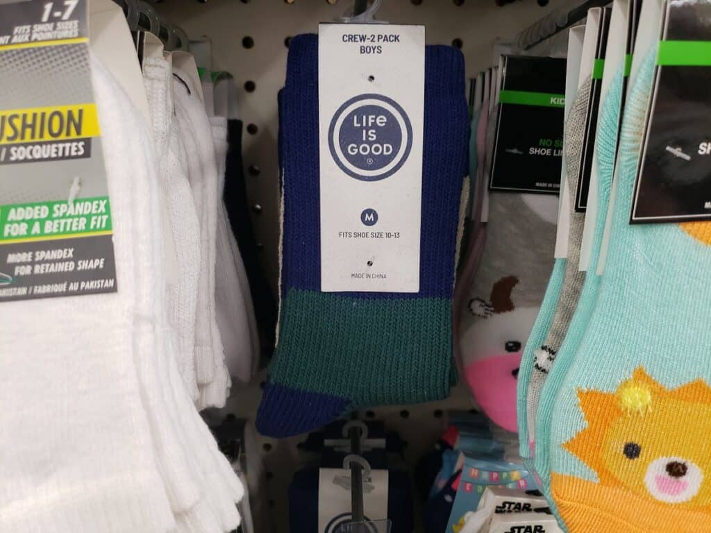 Kids socks on a shelf hanger.