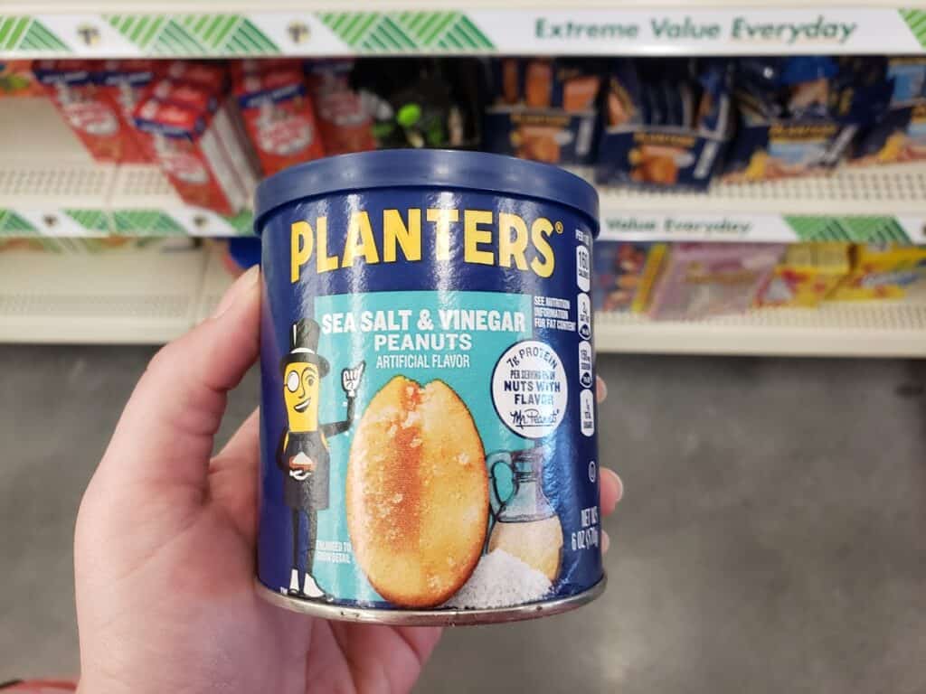 A container of Planters salt and vinegar peanuts.